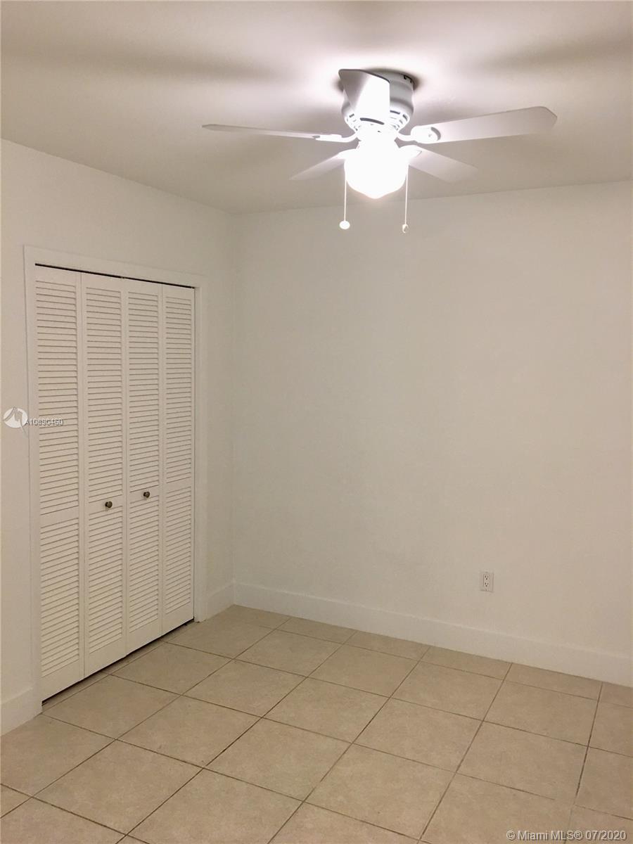 310 Southwest 34th Avenue, Unit 310 Miami, FL 33135 - Photo 17 of 18 wooden floor in an empty room