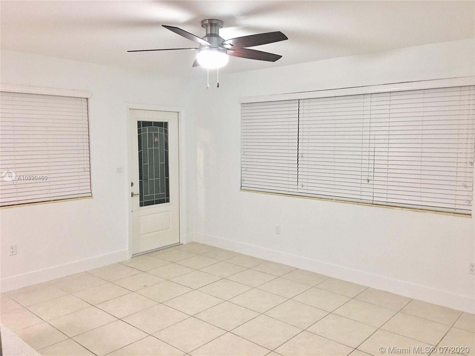 310 Southwest 34th Avenue, Unit 310 Miami, FL 33135 - Photo 4 of 18 a view of an empty room with a window