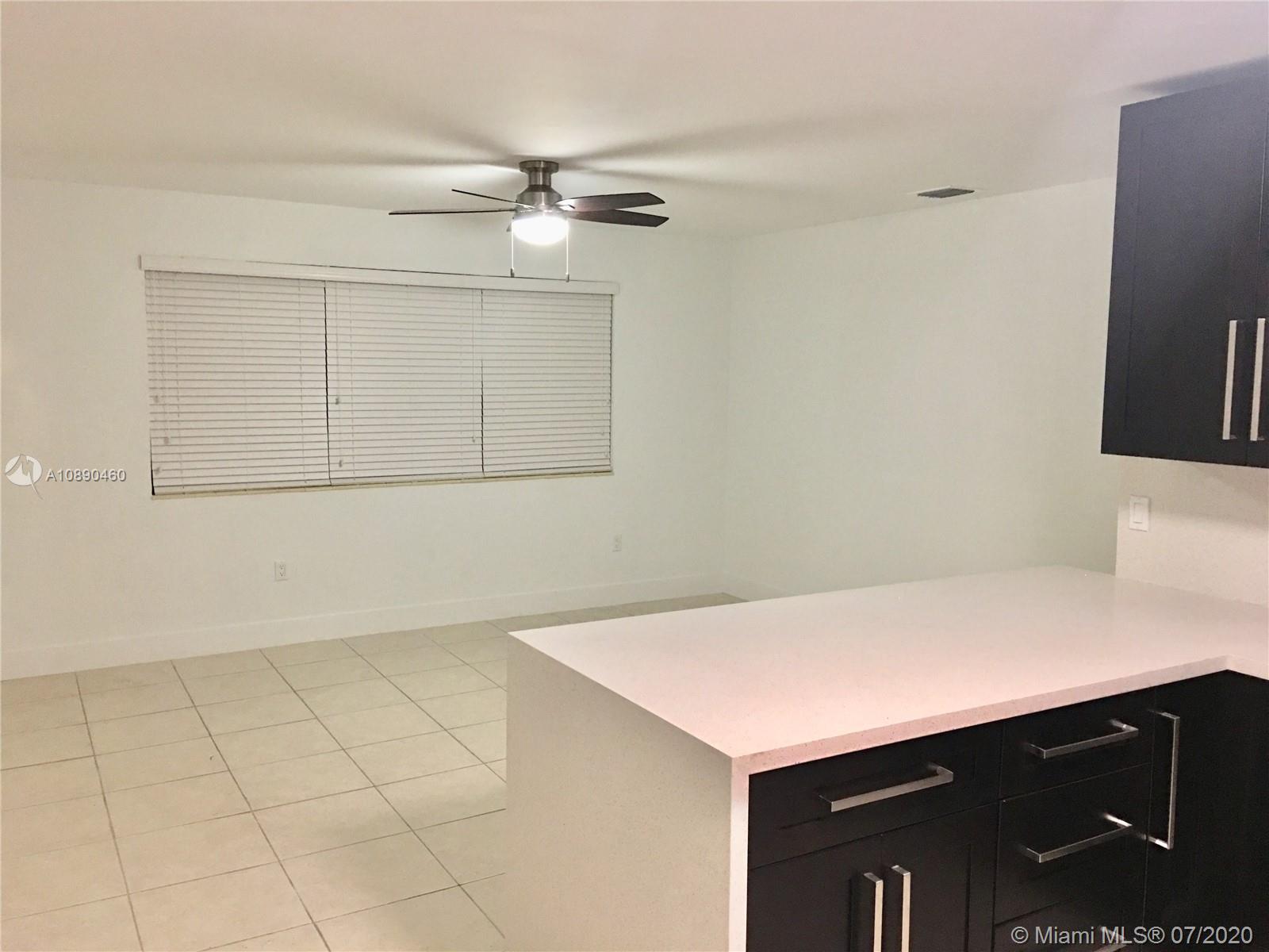 310 Southwest 34th Avenue, Unit 310 Miami, FL 33135 - Photo 6 of 18 a kitchen with a sink cabinets and stainless steel appliances