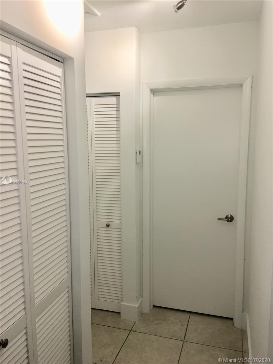 310 Southwest 34th Avenue, Unit 310 Miami, FL 33135 - Photo 8 of 18 a bathroom with a shower