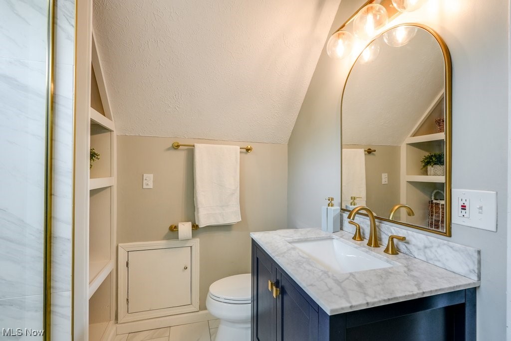 2340 Canterbury Road University Heights, OH 44118 - Photo 25 of 29 Full bathroom with vanity, lofted ceiling, and toilet