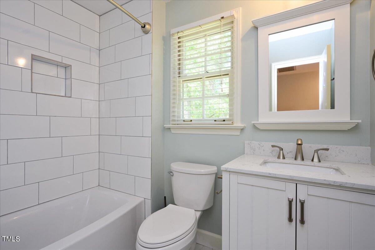 2005 Broadingham Court Raleigh, NC 27615 - Photo 19 of 27 a bathroom with a sink toilet and shower