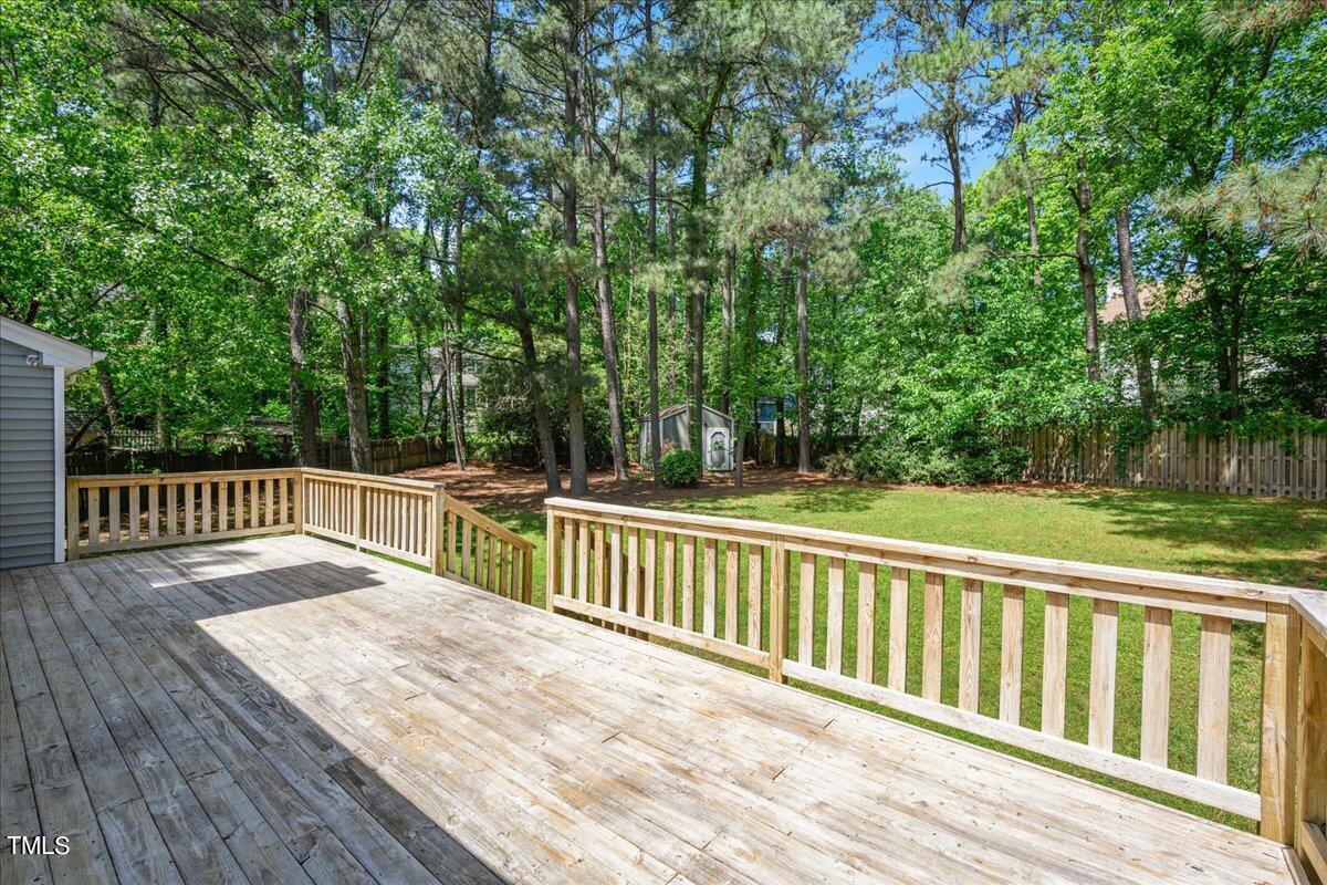 2005 Broadingham Court Raleigh, NC 27615 - Photo 21 of 27 a balcony with wooden floor and trees