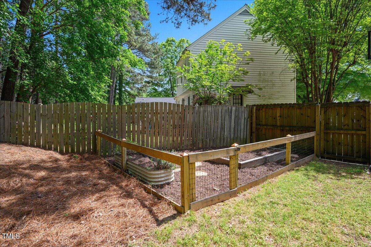 2005 Broadingham Court Raleigh, NC 27615 - Photo 26 of 27 a view of outdoor space with wooden fence