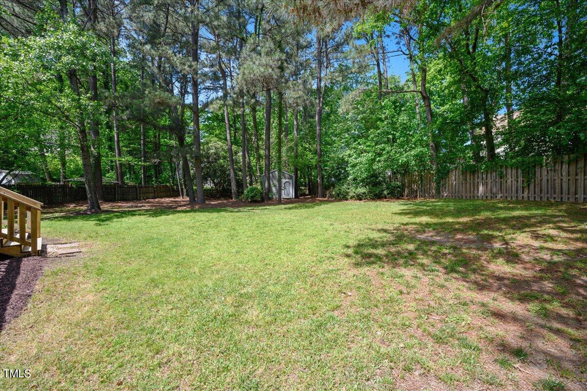 2005 Broadingham Court Raleigh, NC 27615 - Photo 27 of 27 a view of outdoor space with deck and yard