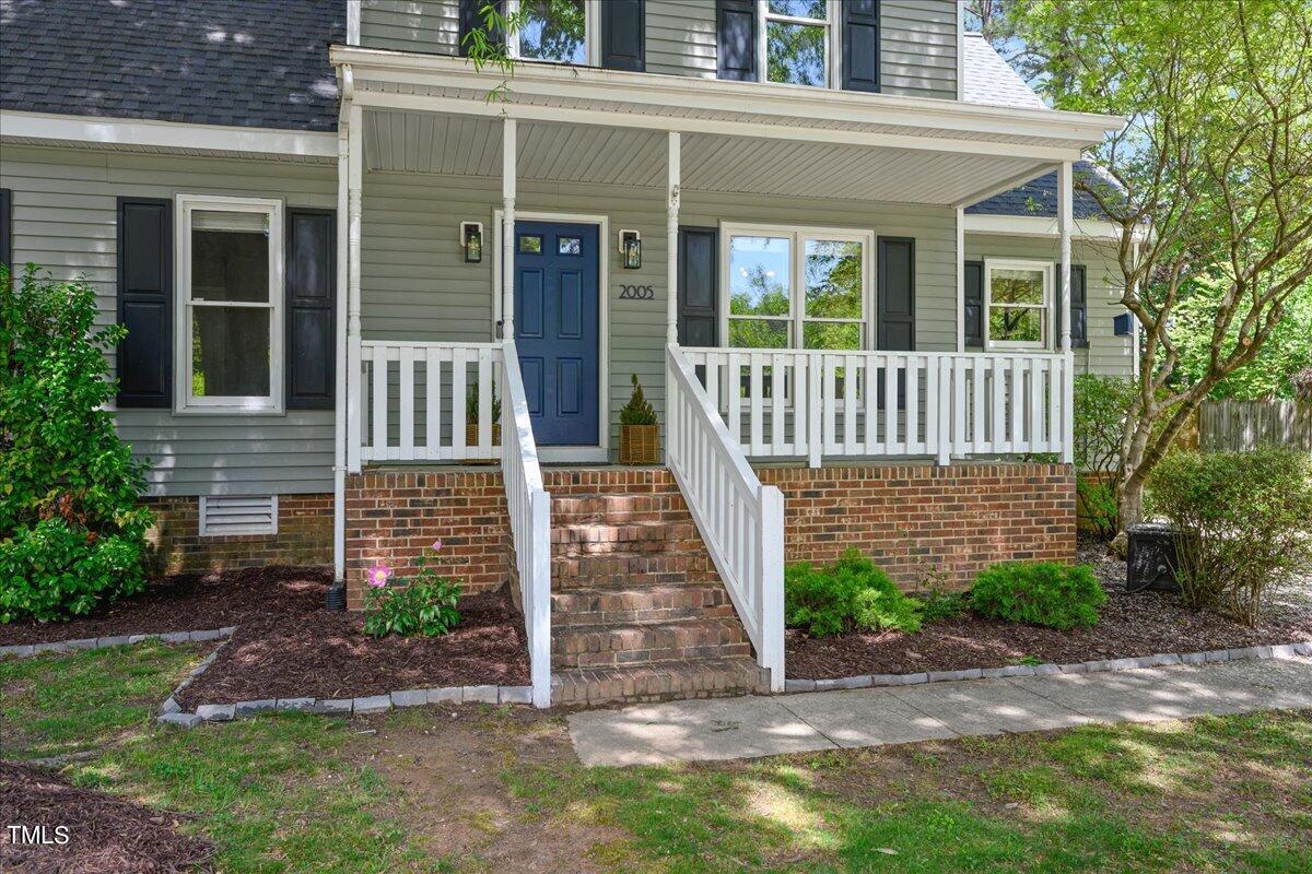 2005 Broadingham Court Raleigh, NC 27615 - Photo 3 of 27 front view of a house with a porch