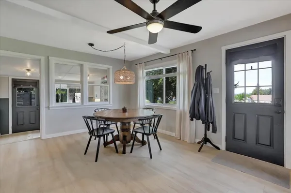 a sink with white cabinets