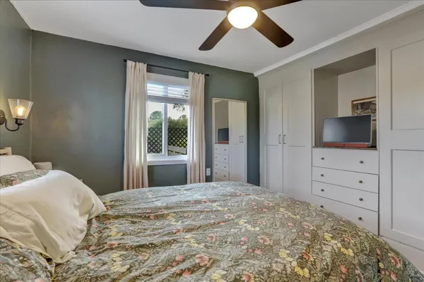 a bed room with a bed and a window