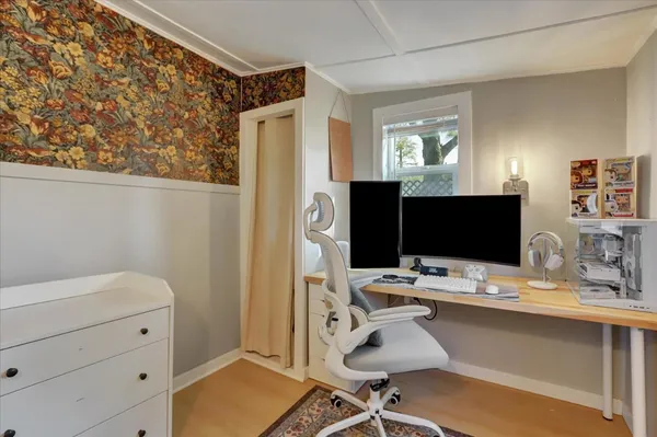 a wooden bench sitting on top of a wooden floor