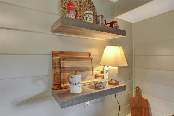 a view of backyard of house and car parked