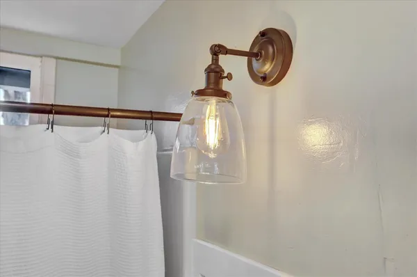 a view of a grassy field with trees in the background