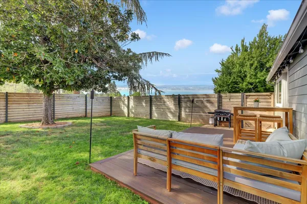 a front view of house with a garden and patio