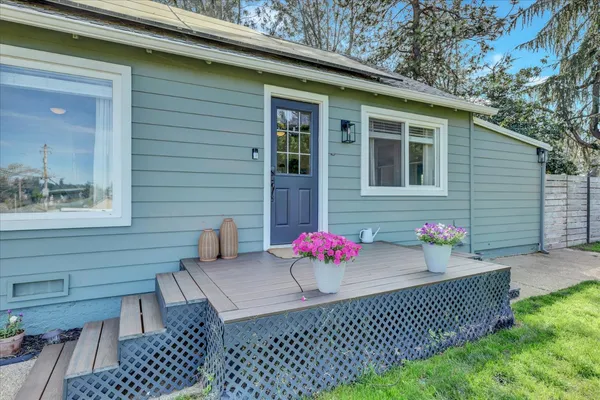 a living room with furniture and a ceiling fan