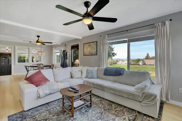 a view of a room that has a bed and a window