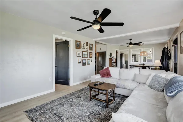 a view of a livingroom with furniture and cabinet