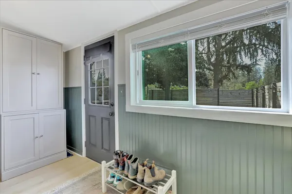 a kitchen with stainless steel appliances a stove a sink and a microwave