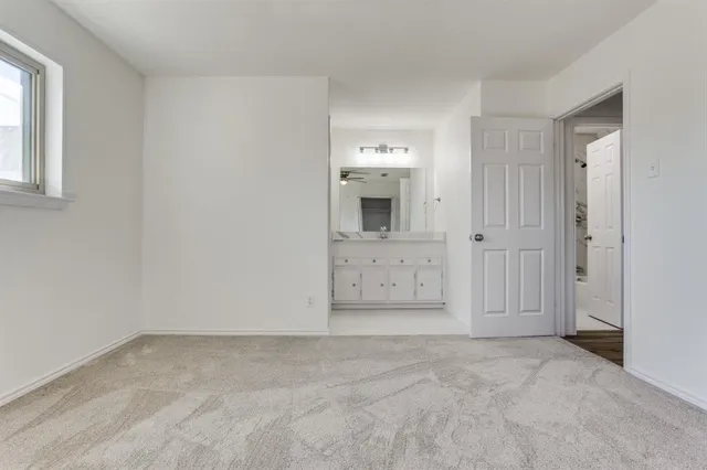 an empty room with a bathroom