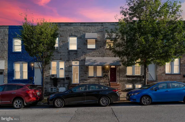 a front view of a house with parking space