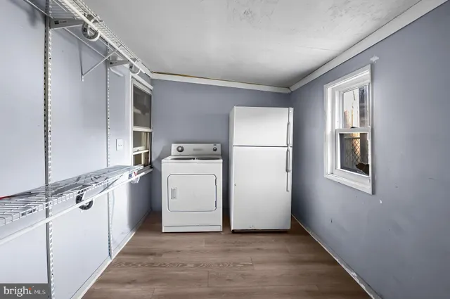 a view of a storage & utility room with a sink