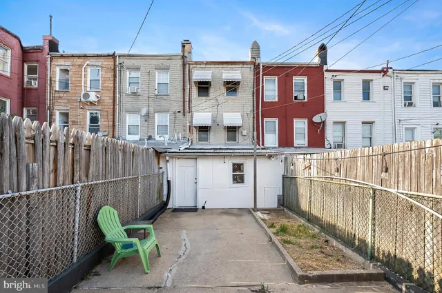 a balcony view with a seating space