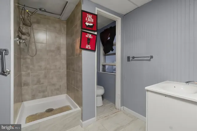 a bathroom with a shower and a toilet