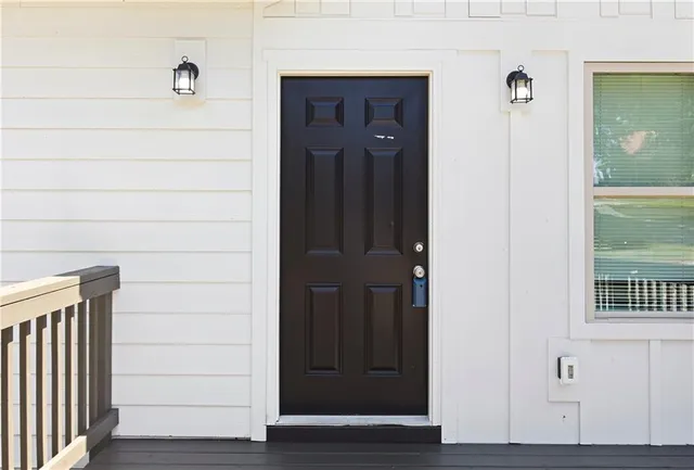 a view of front door with wooden floor