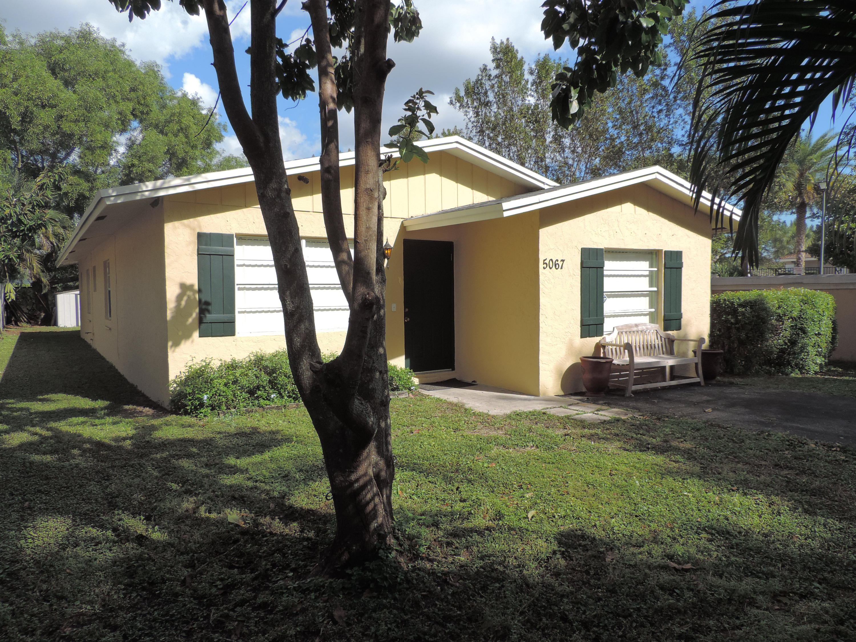 5067 Adams Road Delray Beach, FL 33484 - Photo 1 of 15 front