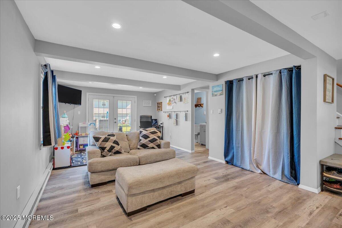 6 Reno Court Barnegat, NJ 08005 - Photo 14 of 35 a living room with furniture and a flat screen tv