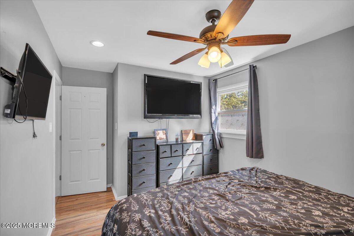 6 Reno Court Barnegat, NJ 08005 - Photo 15 of 35 a bedroom with a bed and a flat screen tv