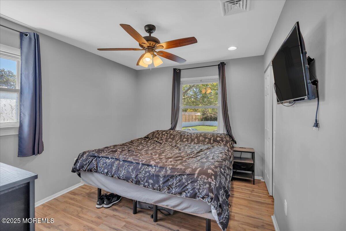 6 Reno Court Barnegat, NJ 08005 - Photo 16 of 35 a bedroom with a bed and a flat screen tv