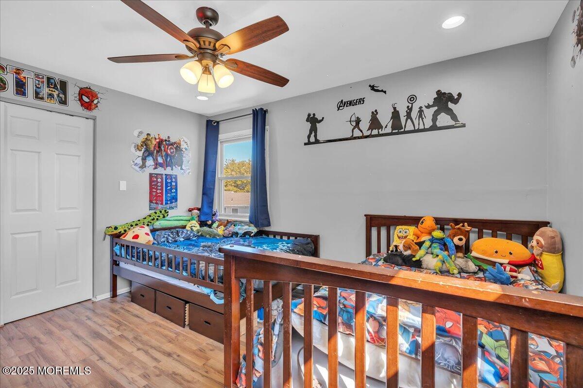 6 Reno Court Barnegat, NJ 08005 - Photo 17 of 35 a bedroom with furniture a baby crib and a painting on the wall