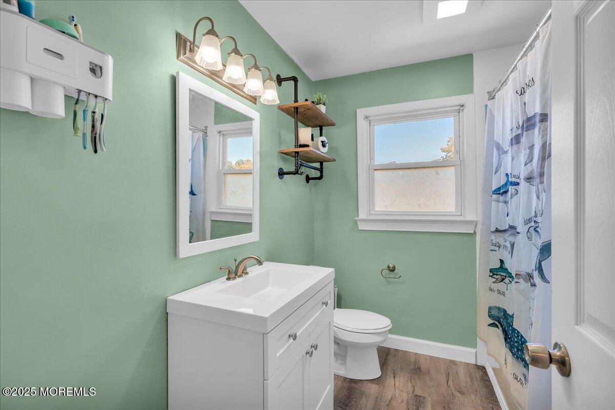 6 Reno Court Barnegat, NJ 08005 - Photo 19 of 35 a bathroom with a toilet sink and mirror