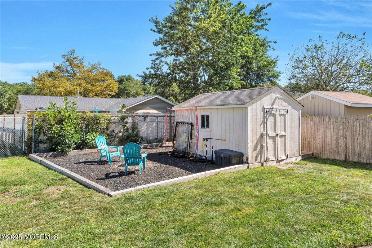 6 Reno Court Barnegat, NJ 08005 - Photo 22 of 35 a backyard of a house with table and chairs