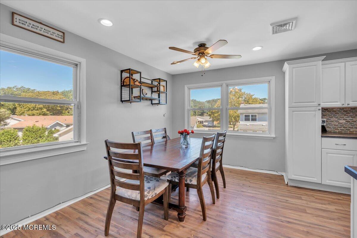 6 Reno Court Barnegat, NJ 08005 - Photo 7 of 35 a view of a dining room with furniture window and wooden floor
