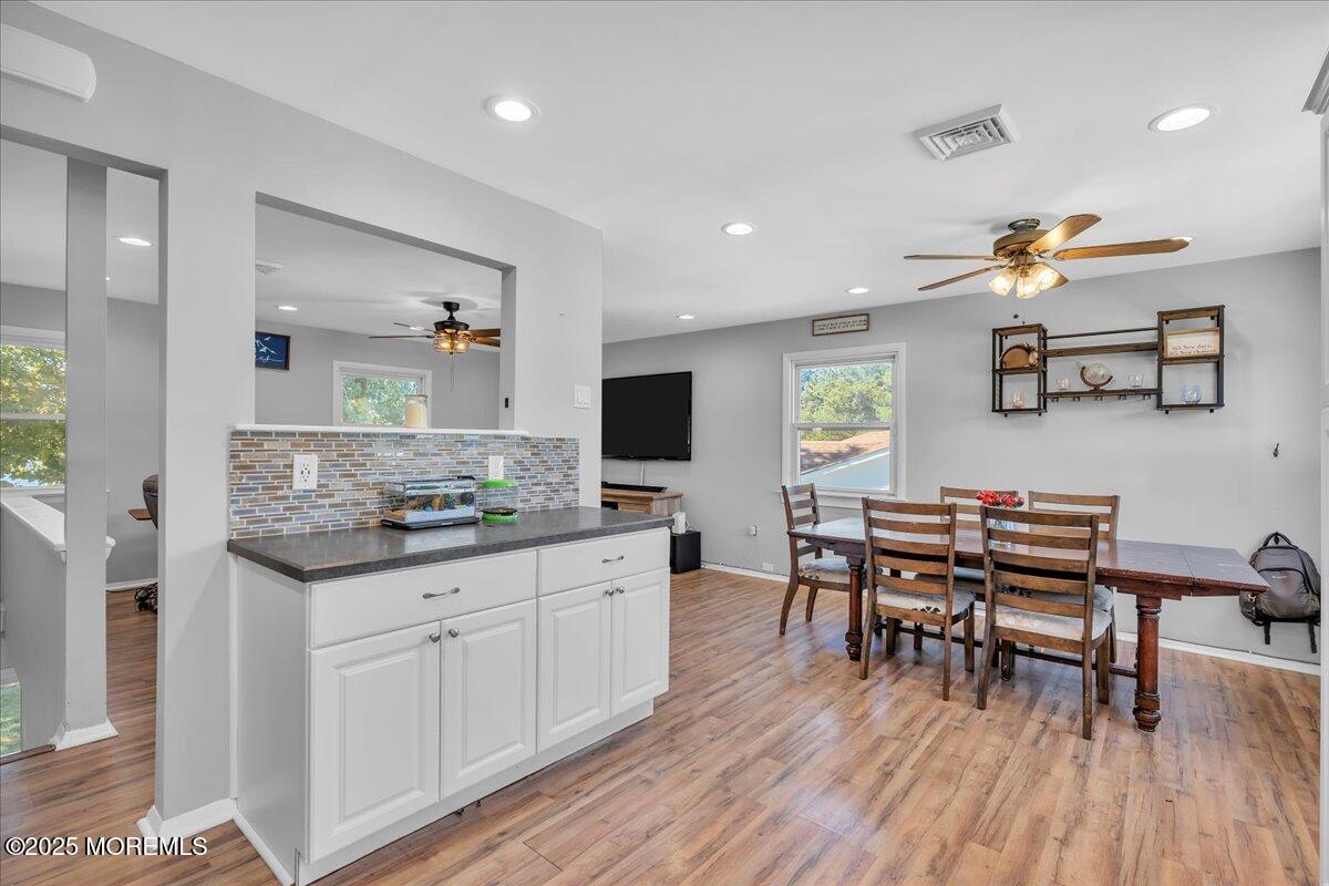 6 Reno Court Barnegat, NJ 08005 - Photo 8 of 35 a kitchen with stainless steel appliances granite countertop a stove and a wooden floors