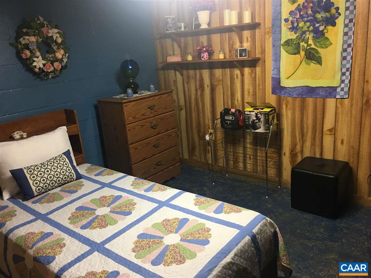 1715 Oneals Road Madison, VA 22727 - Photo 11 of 11 a bedroom with a bed and wooden floor