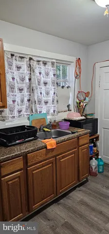 a kitchen with stainless steel appliances granite countertop a stove and a sink
