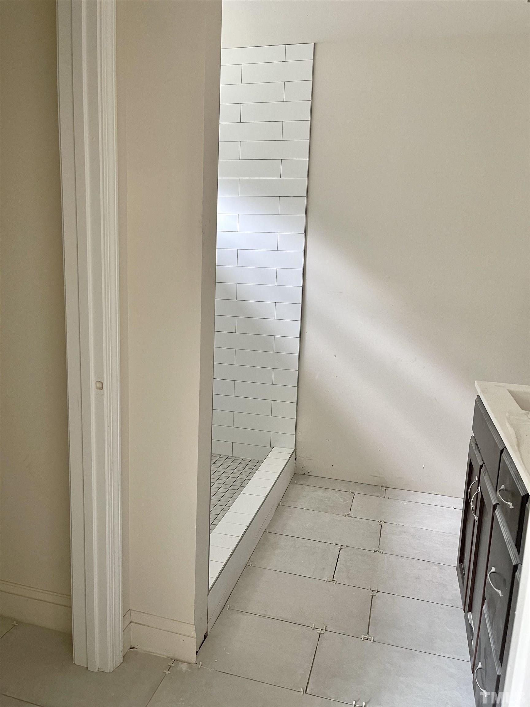 830 Mulberry Road Spring Hope, NC 27882 - Photo 12 of 18 a bathroom with a glass shower door