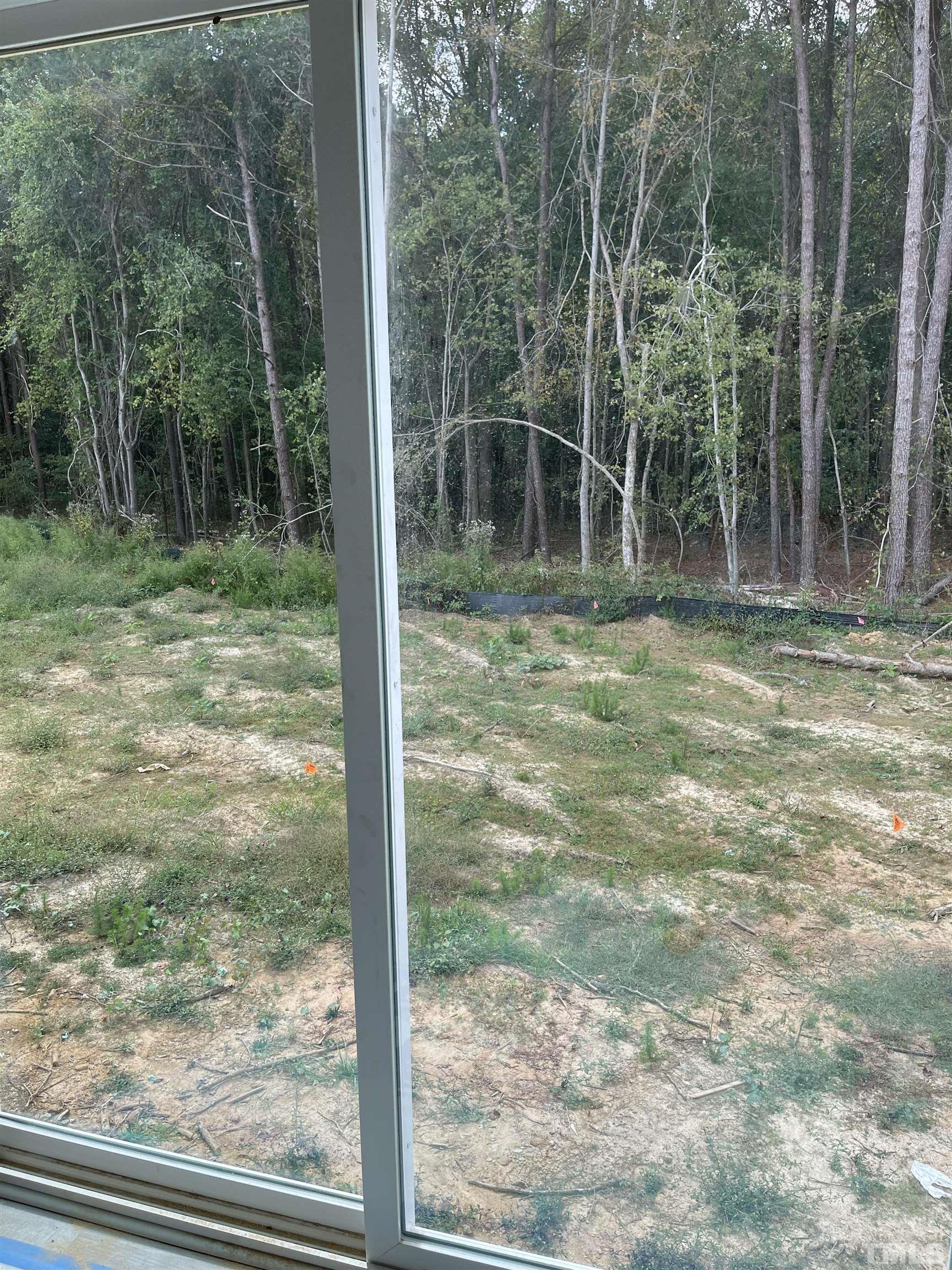830 Mulberry Road Spring Hope, NC 27882 - Photo 9 of 18 a view of a yard from a window