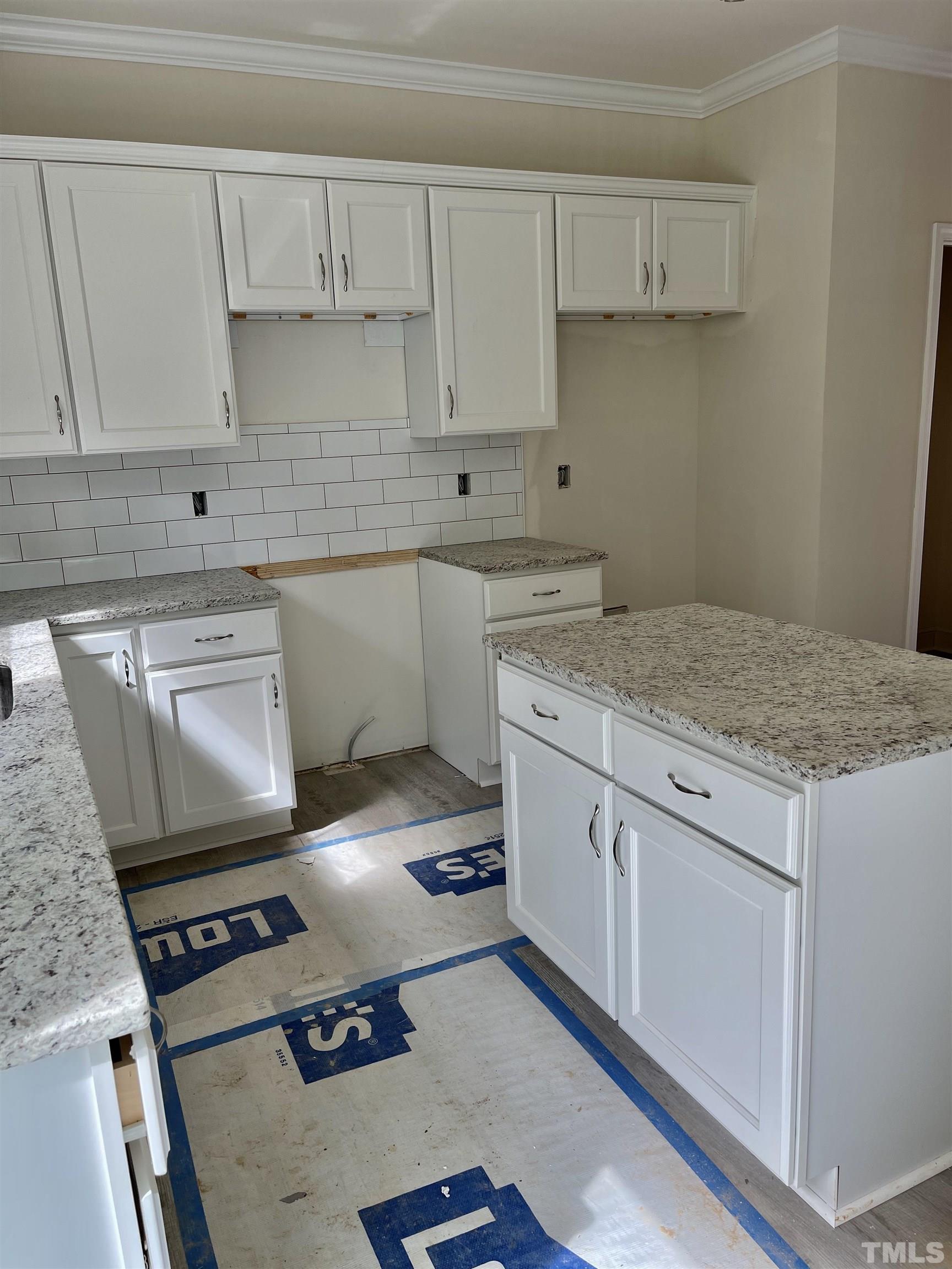 830 Mulberry Road Spring Hope, NC 27882 - Photo 10 of 18 a kitchen with a stove white cabinets sink and dishwasher
