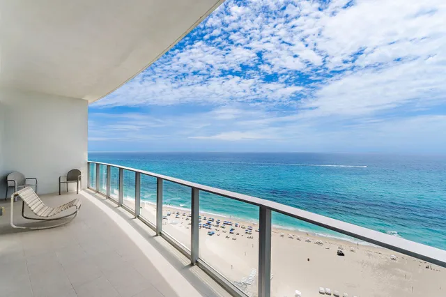 a view of balcony with furniture