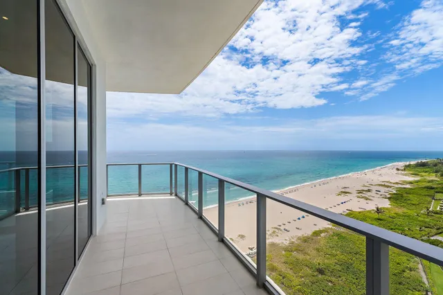 a view of a balcony with an ocean view