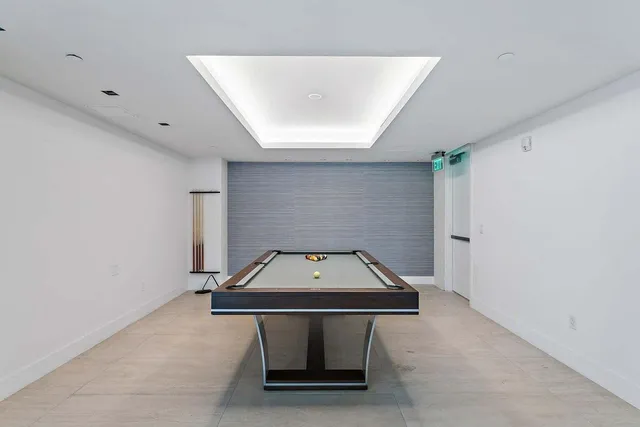 a living room with a table and chairs