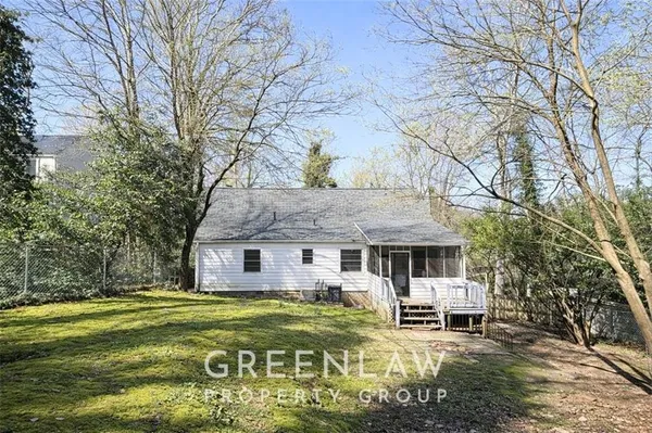 a front view of a house with swimming pool and sitting area