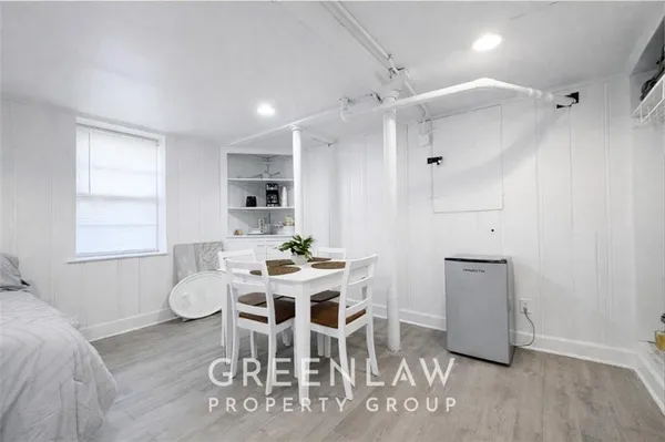 a view of a dining room with furniture and window