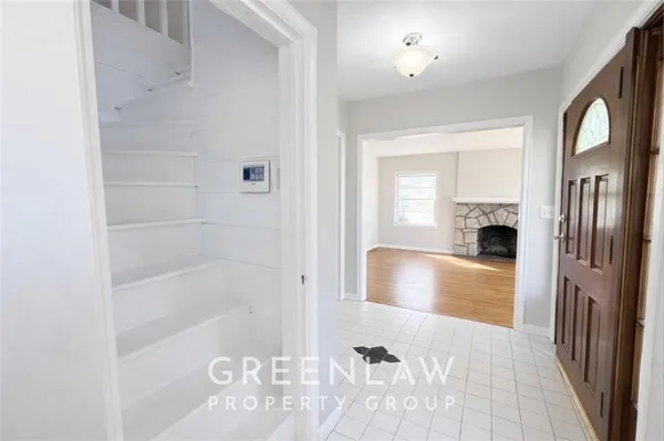 a bathroom with a tub shower and a sink