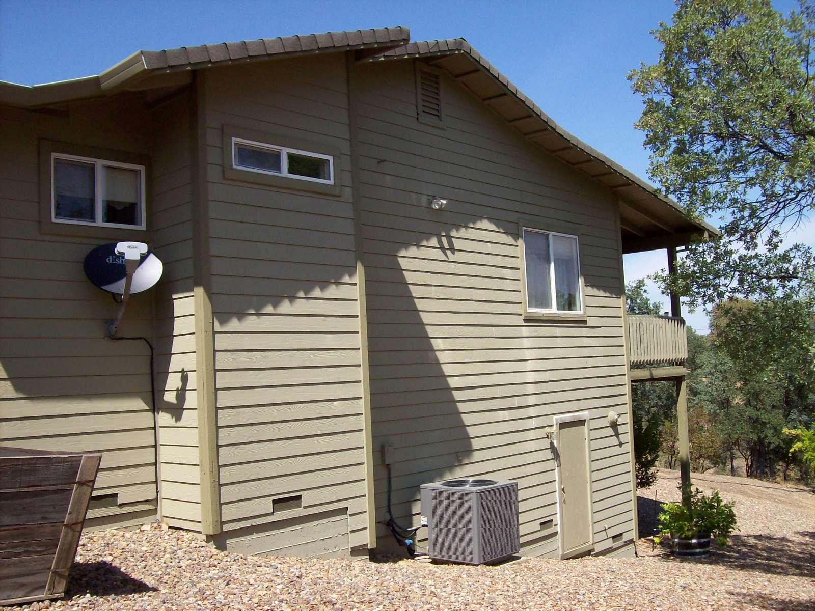 18665 Saddleback Ridge Road Cottonwood, CA 96022 - Photo 37 of 41 Rear of Home w/Basement Storage Door