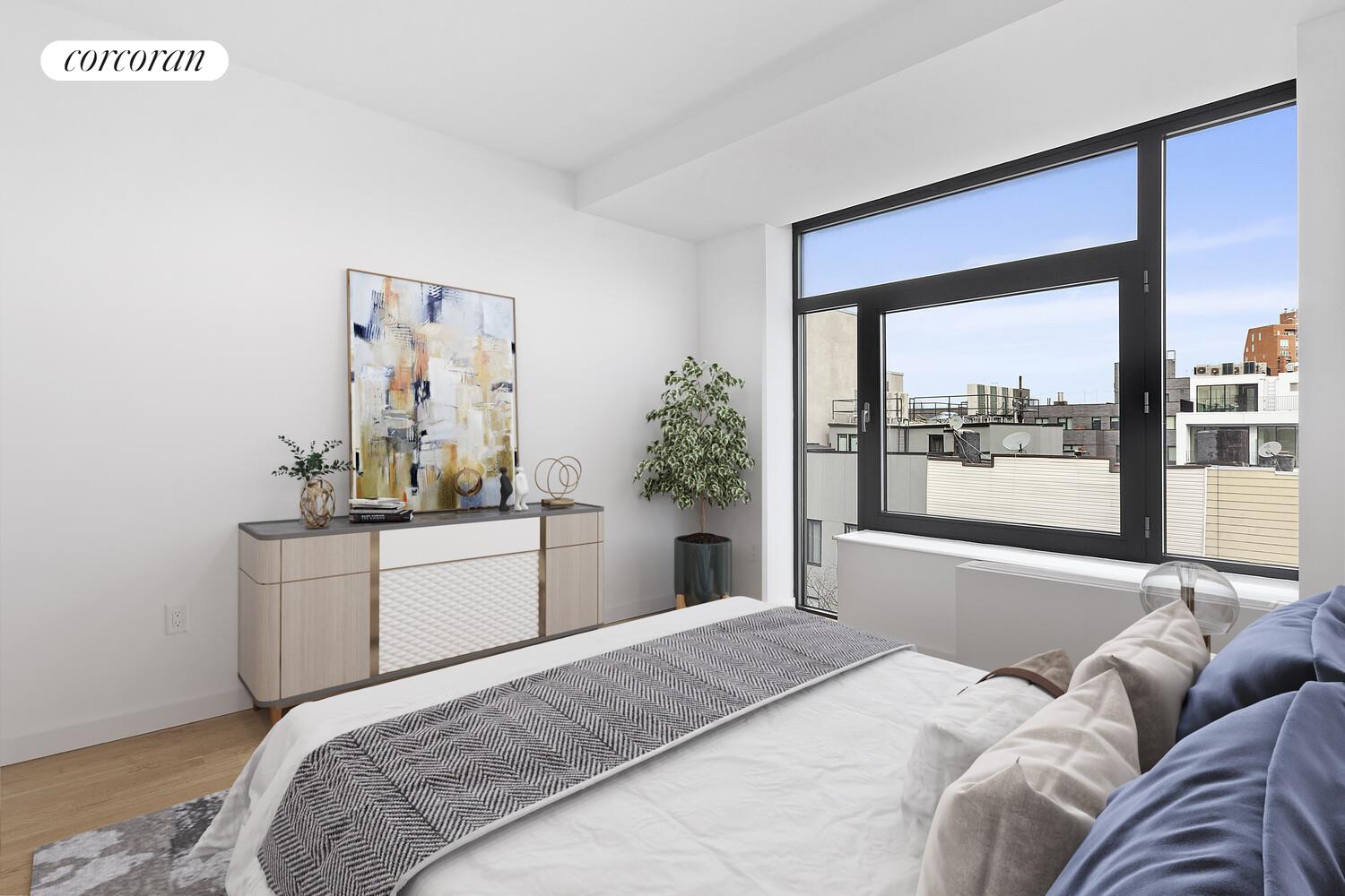 247 North 7th Street, Unit 2 308 Brooklyn, NY 11211 - Photo 4 of 15 a bedroom with a bed and a large window