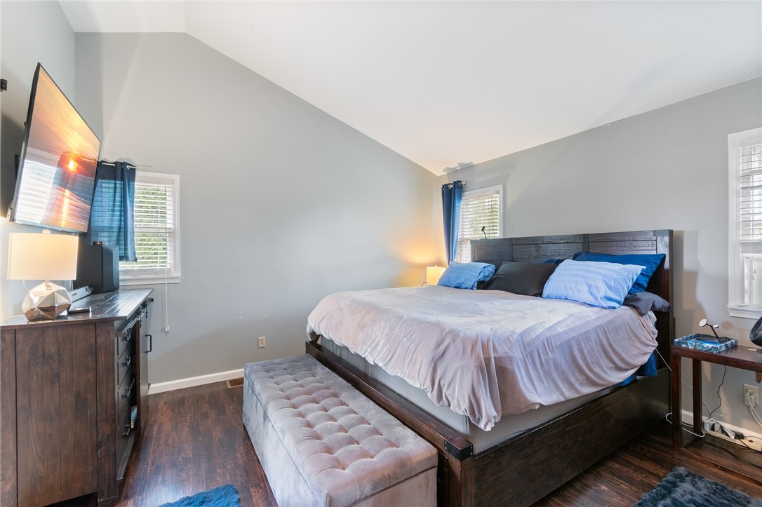 7128 Lake Bluff Road Wolcott, NY 14590 - Photo 21 of 43 Large 1st floor primary bedroom with cathedral cei