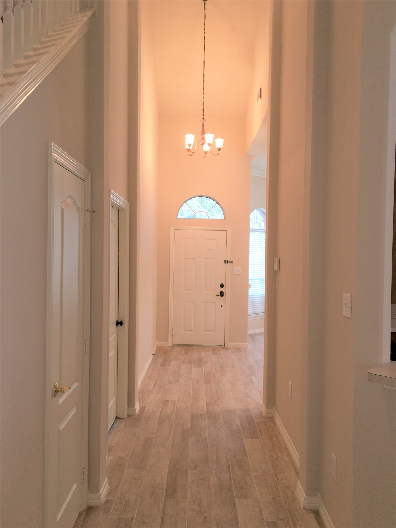 2214 Valley View Crossing Conroe, TX 77304 - Photo 7 of 23 a view of a hallway with wooden floor